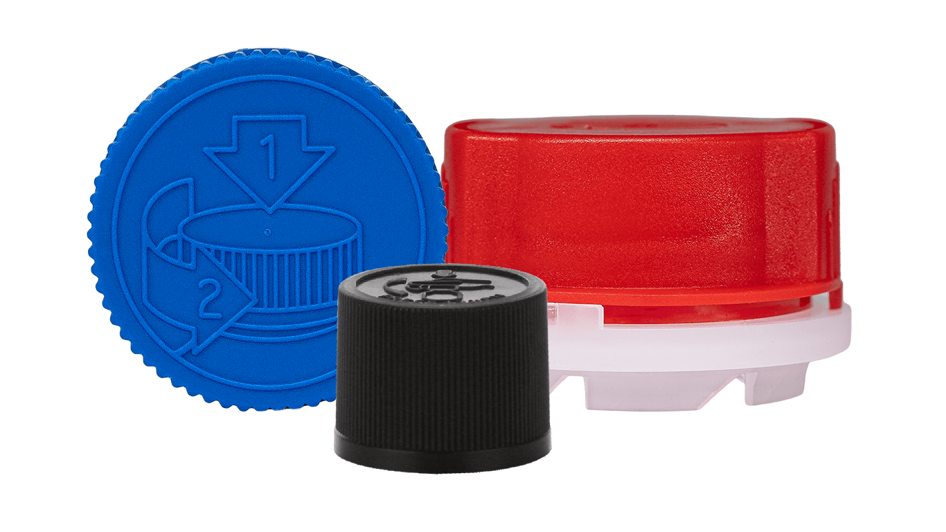 Child-resistant caps (CRCs) including a blue crc with pictorial instructions, a red gasket-style and a black crc with pictorial instructions.