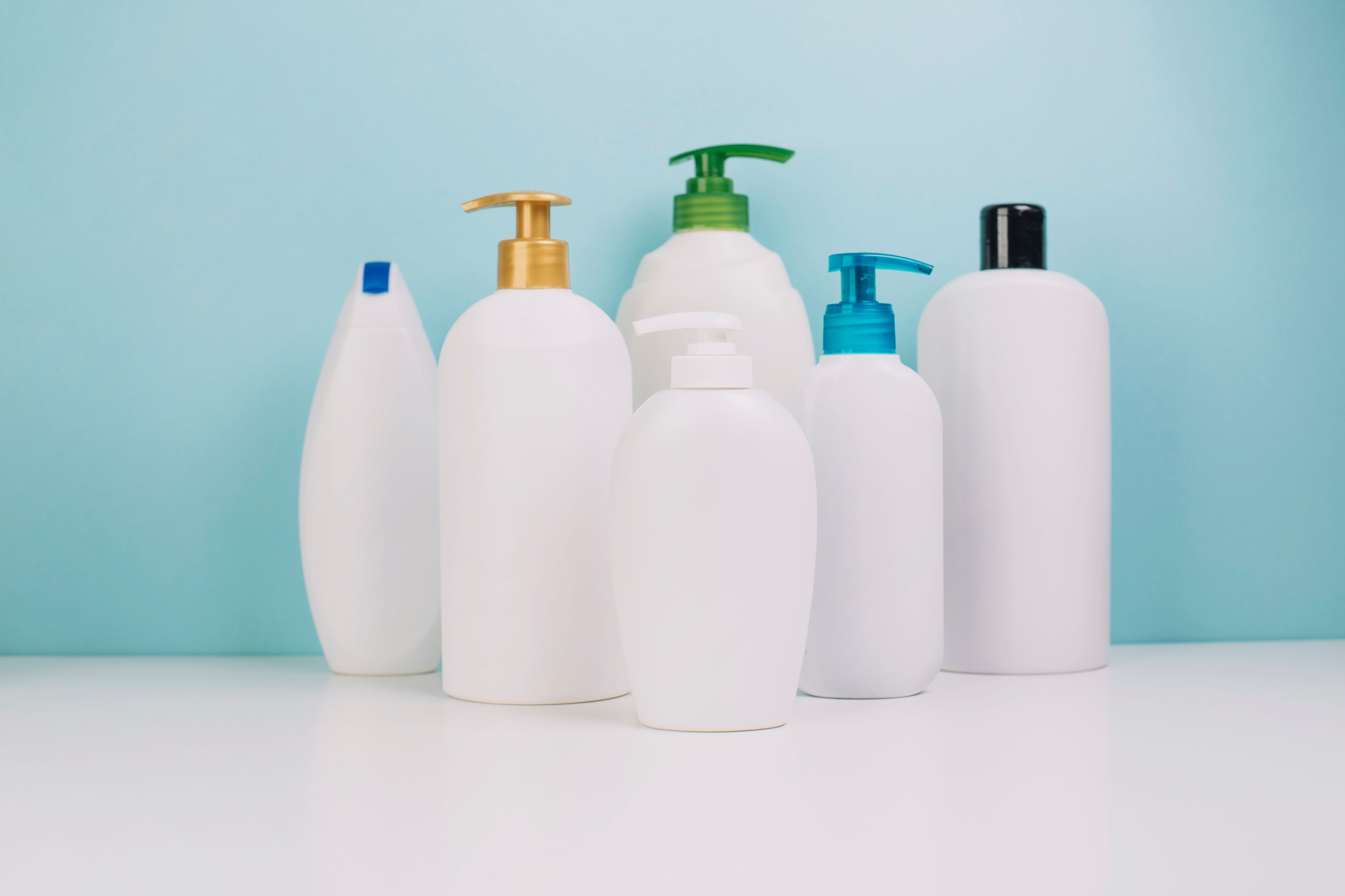 A collection of varying bottle/dispensing options for a shampoo/conditioner product